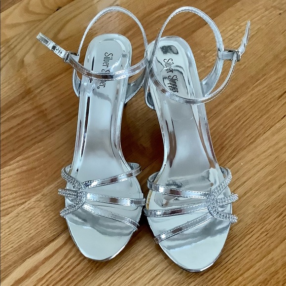 Strappy silver shoes with rhinestones
Heel is 2.75” H - Picture 2 of 5